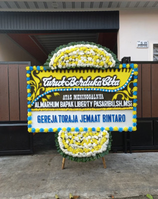 Papan Bunga Duka di Sumo